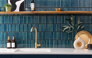blue and green kitkat mosaic tiles on kitchen splashback