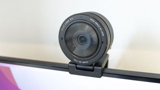 A Razer Kiyo Pro webcam on top of a monitor; one of the best Mac webcams