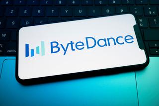 The ByteDance logo displays on a smartphone screen placed on a laptop keyboard illuminated by blue light. TikTok's parent company announces on February 10, 2026, the launch of Seedream 5.0, an image-generating AI capable of competing with industry leaders in Creteil, France, on February 12, 2026. (Photo by Samuel Boivin/NurPhoto via Getty Images)