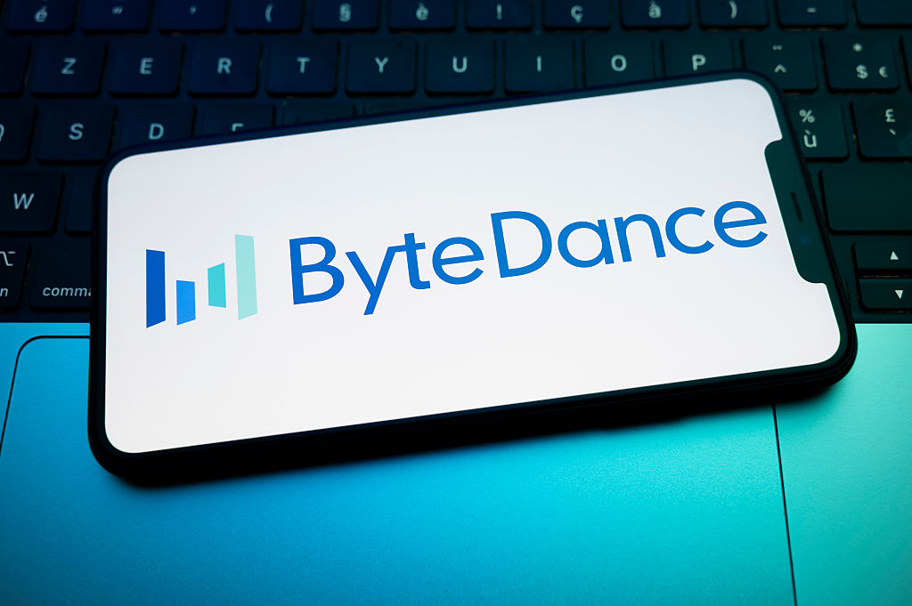 The ByteDance logo displays on a smartphone screen placed on a laptop keyboard illuminated by blue light. TikTok&amp;apos;s parent company announces on February 10, 2026, the launch of Seedream 5.0, an image-generating AI capable of competing with industry leaders in Creteil, France, on February 12, 2026. (Photo by Samuel Boivin/NurPhoto via Getty Images)
