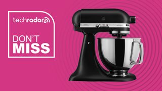 Black KitchenAid stand mixer on pink background