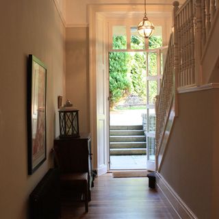 hallway with wooden table and wall picture