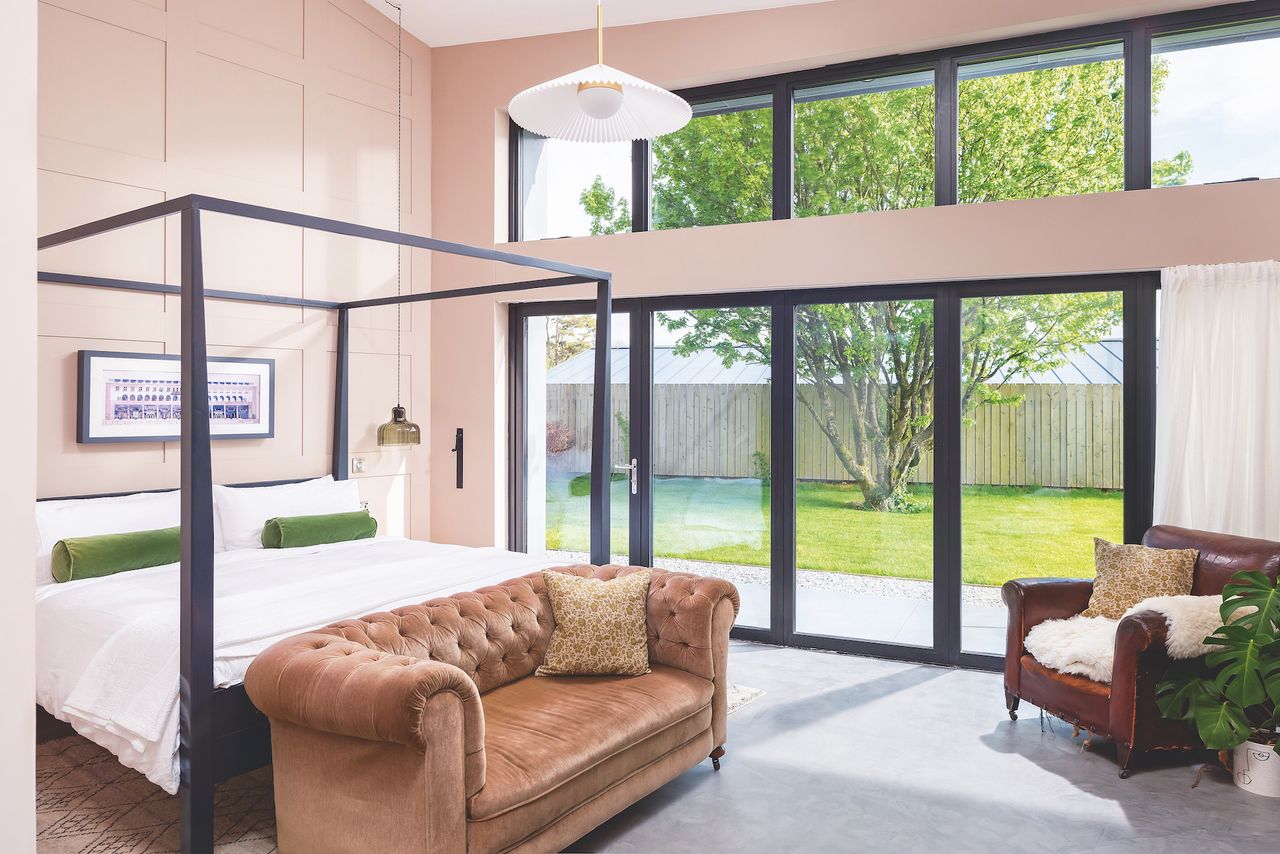 large windows in pink bedroom in self build