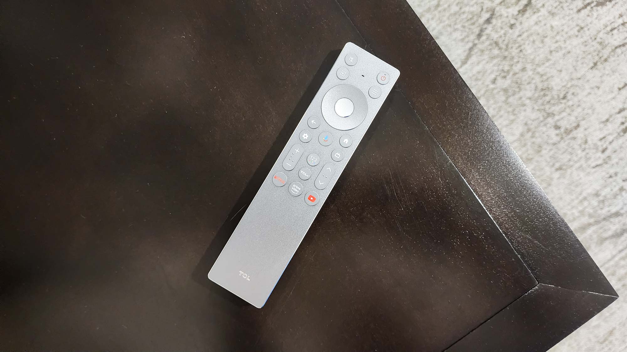 The remote for a TCL QM8K QD-Mini LED TV.