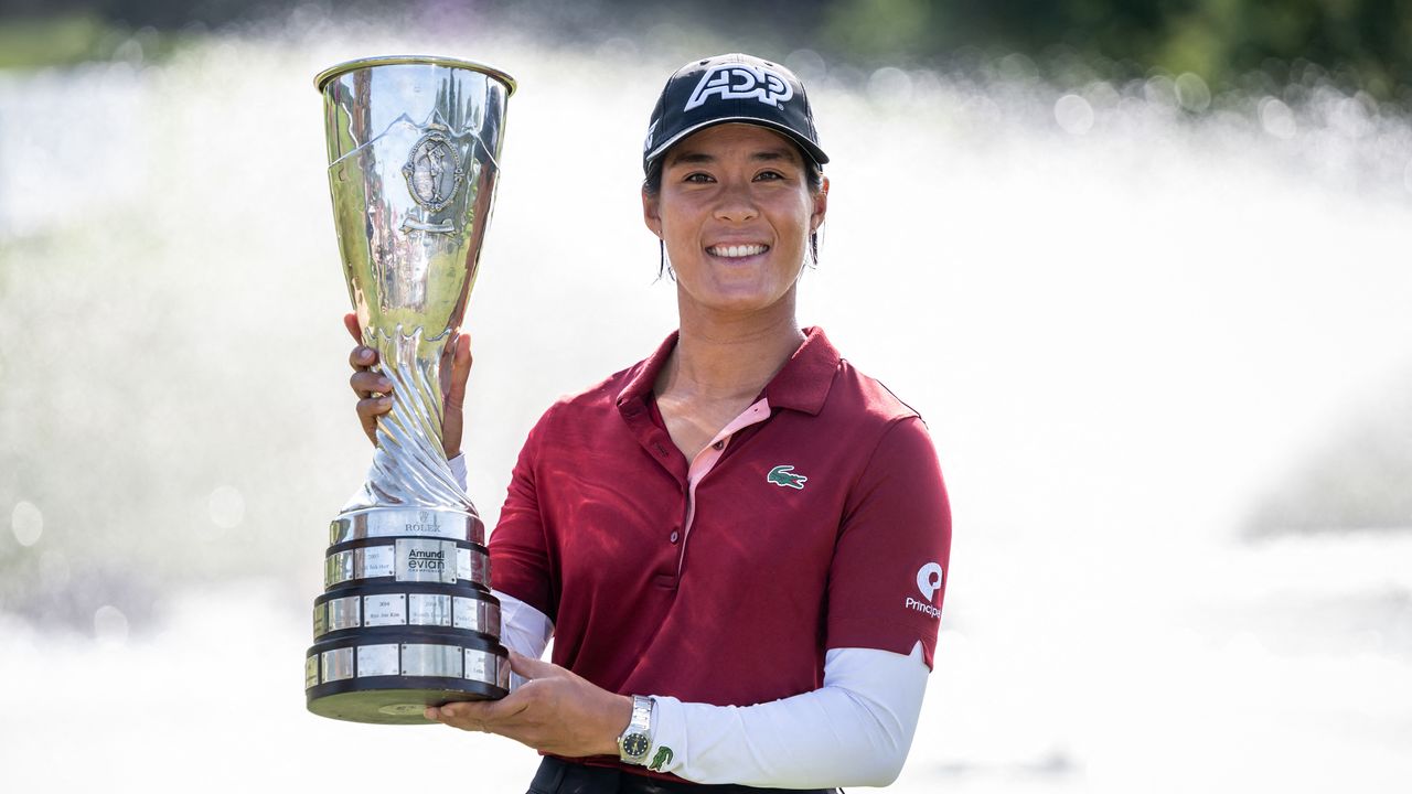 Celine Boutier holds the 2023 Evian Championship trophy