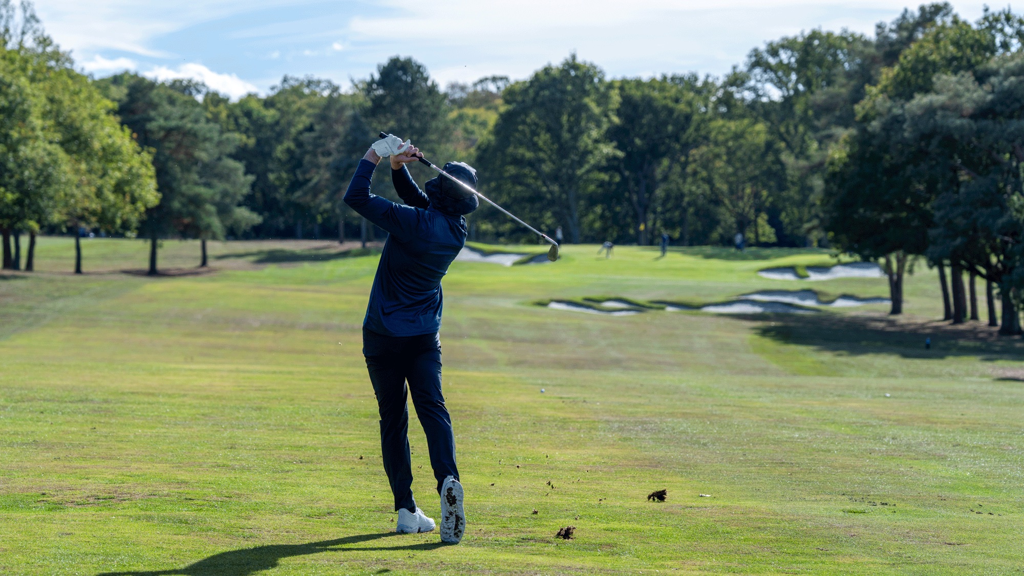 Baz Plummer in the finish position after hitting the Srixon Q-Star Tour 2026 golf ball on the fairway at Hadley Wood Golf Club
