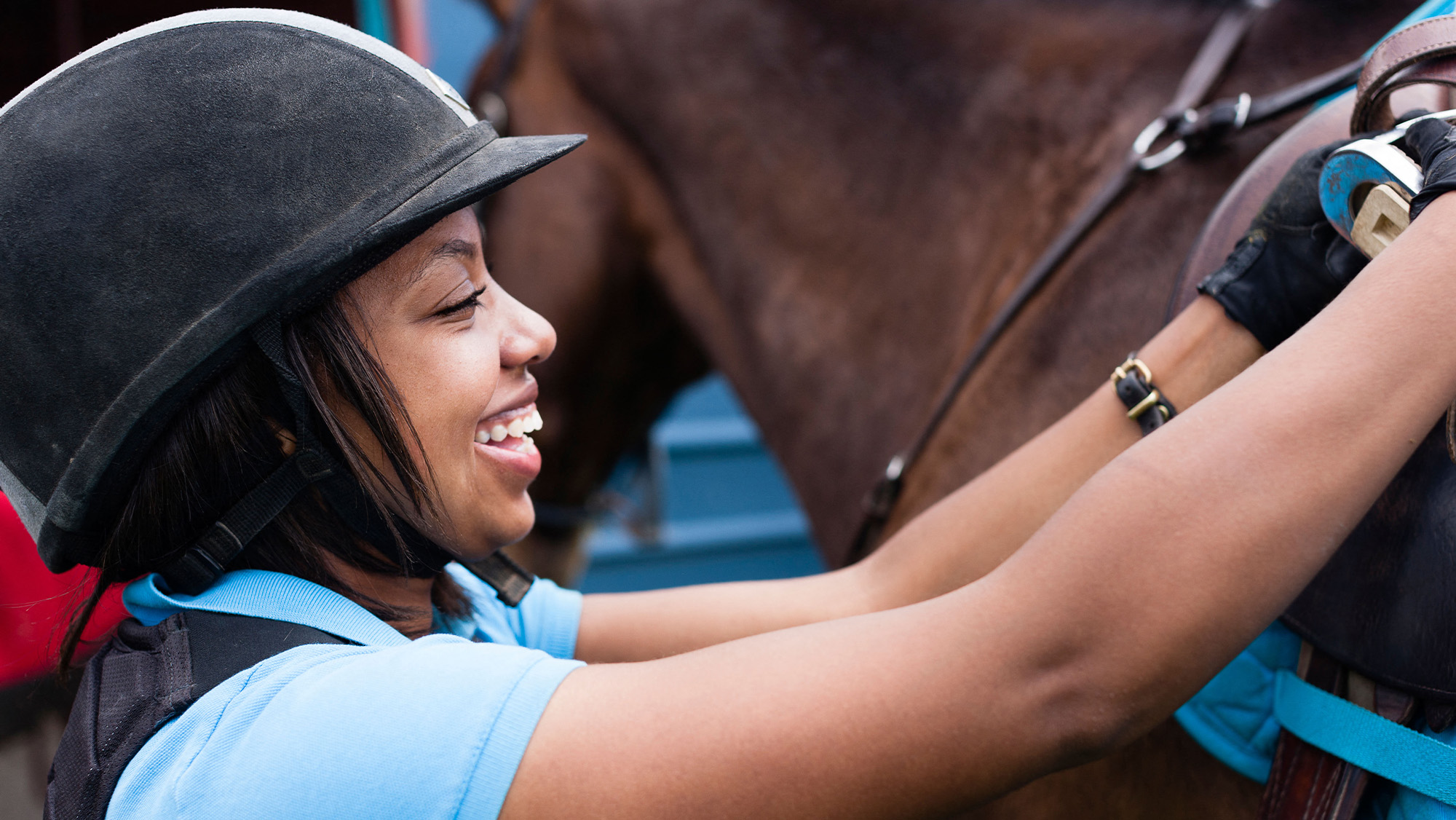 Close up of horse rider wearing a riding hat