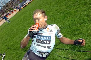 A tired and dirty Baden Cooke (Saxo Bank-SunGard) enjoys a drink