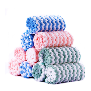 A stack of pink, green, and blue zigzag microfiber towels
