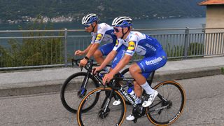 Davide Ballerini of Italy and Remco Evenepoel of Belgium cycle side by side in the 