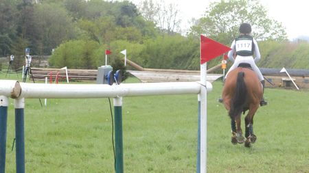 A horse and rider leaving the cross-country start box at Aston le Walls