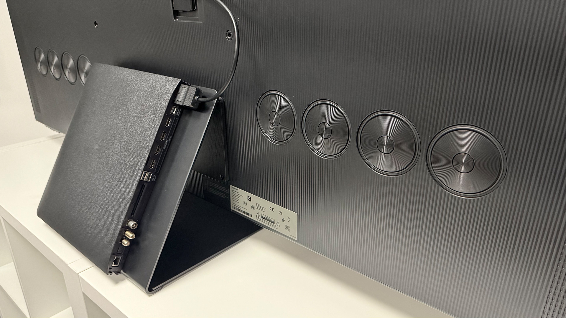 Samsung S95F OLED TV showing rear of TV and OneConnect box with connections
