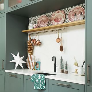 Green kitchen with christmas decor