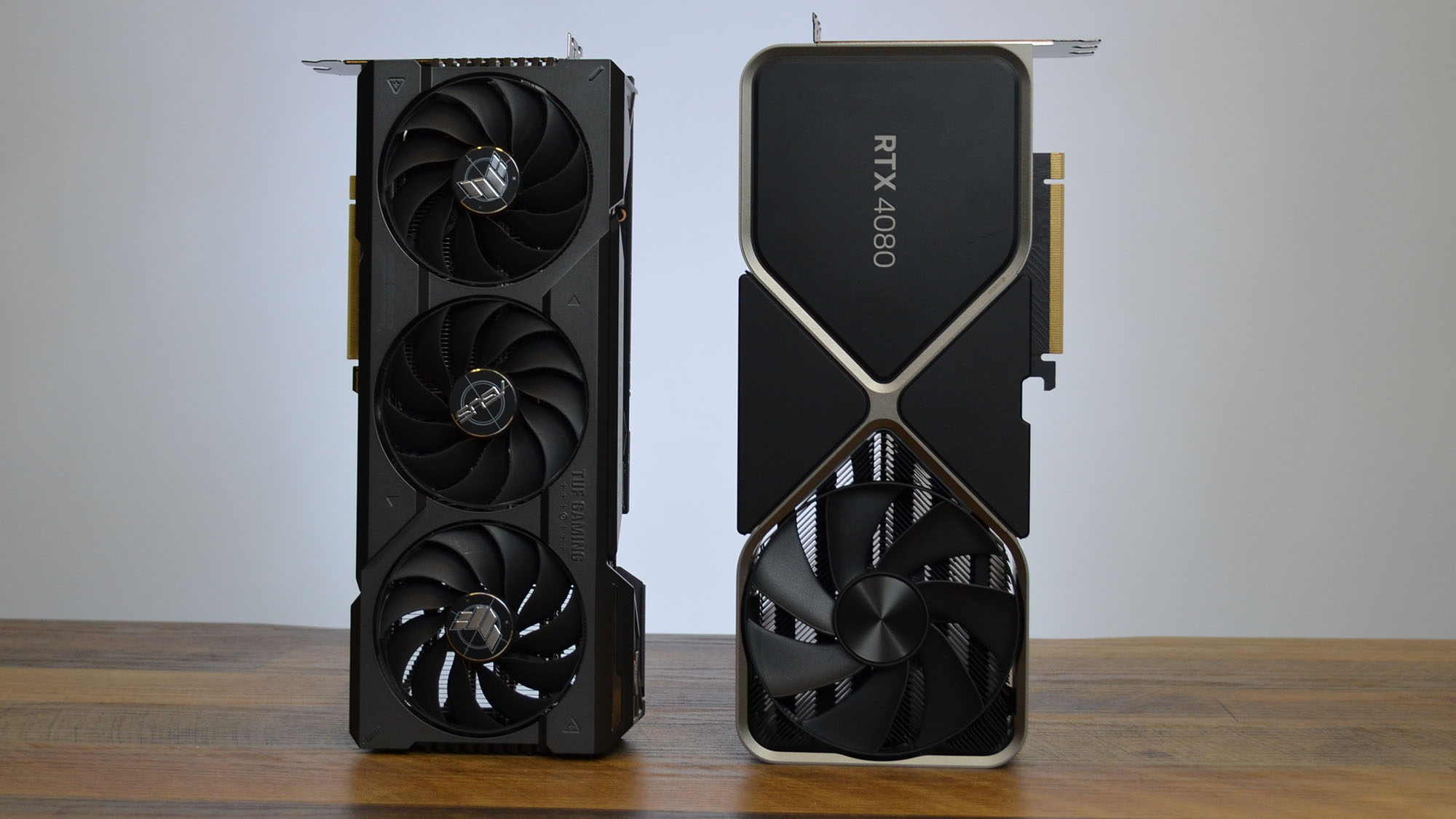 An Nvidia GeForce RTX 4070 Ti graphics card on a wooden table with its retail packaging