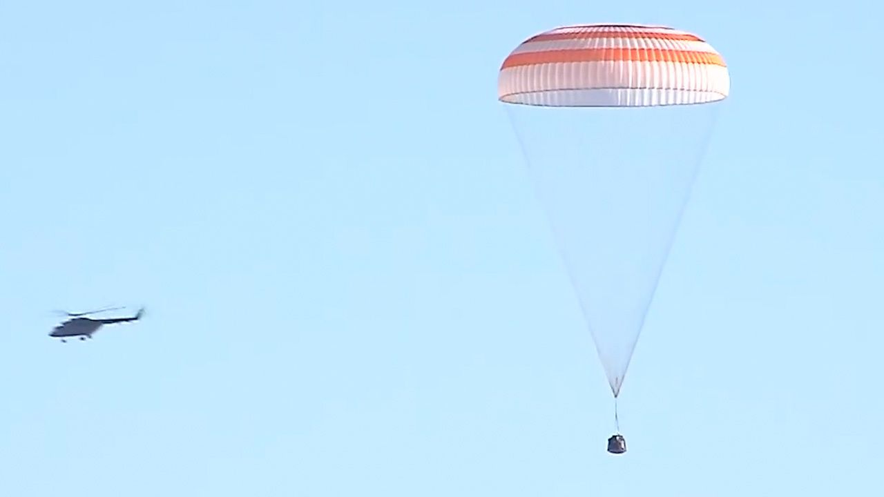 The Russian Soyuz MS-22 space capsule descends under its main parachute as it lands on the steppes of Kazakhstan on March 28, 2023.