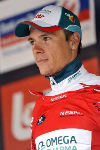 Stage 1 winner Philippe Gilbert (Omega Pharma-Lotto) dons the red jersey.