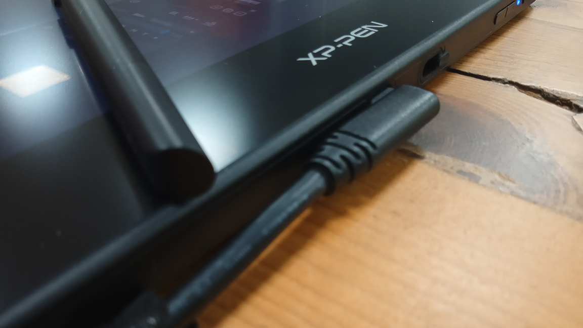 Artist 16 (2nd gen) review; represented by a photo of a lead plugged into a tablet