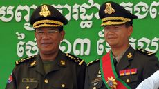 Cambodian Prime Minister Hun Sen posing with his son, Hun Manet