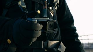 The GoPro Mission 1 Pro with the point-and-shoot grip accessory