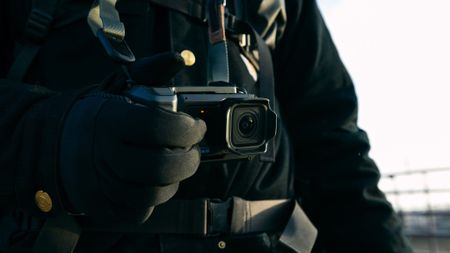 The GoPro Mission 1 Pro with the point-and-shoot grip accessory
