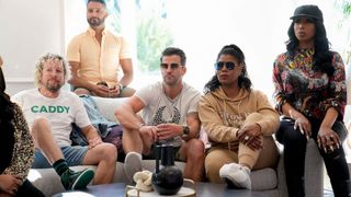 Jonny Fairplay, Shake Chatterjee, Johnny Bananas, Omarosa Manigault Newman, and Tiffany "New York" Pollard sit in front of a large window in 'House of Villians'