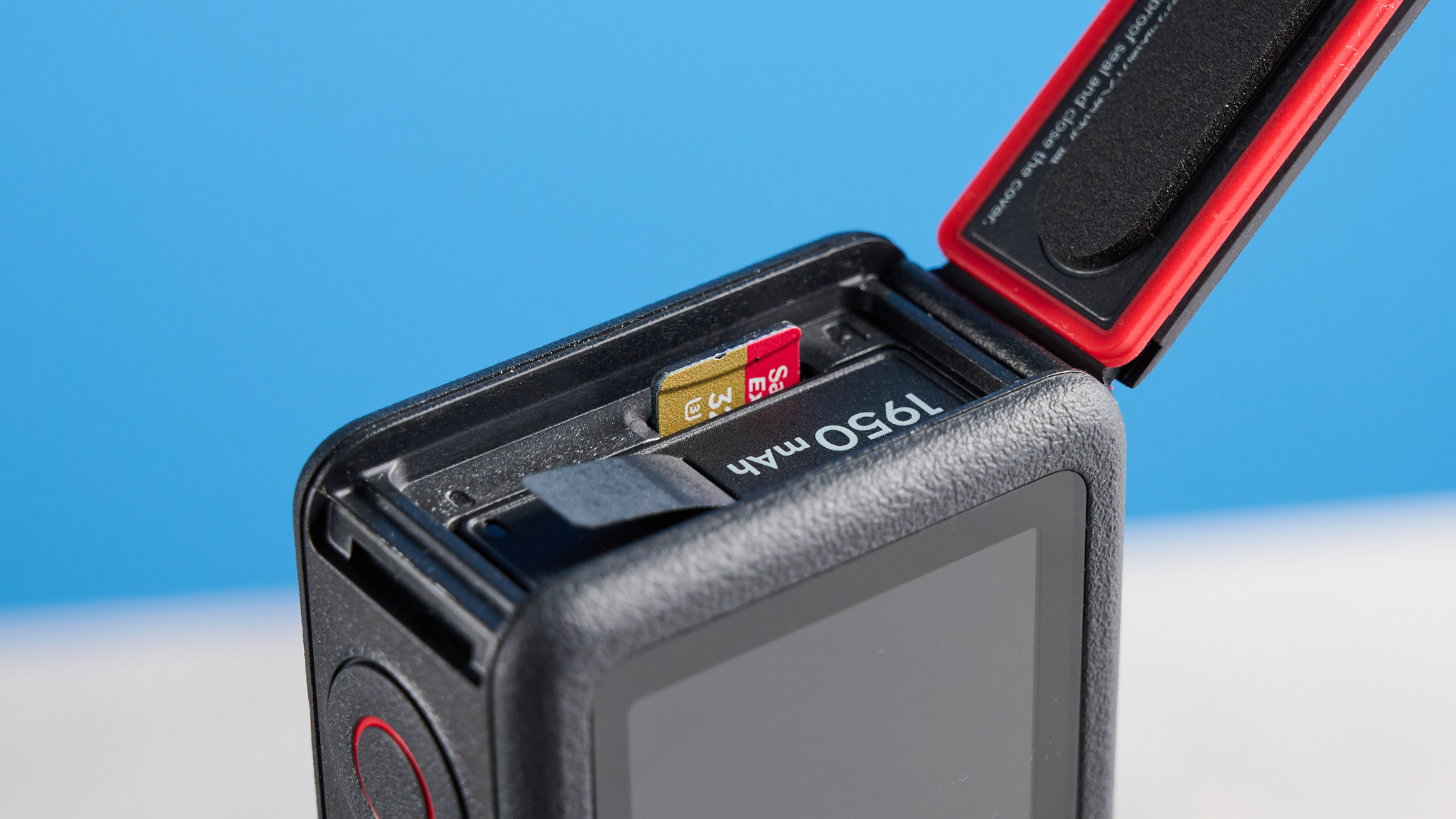 The DJI Osmo Action 6 on a stone surface with a blue background