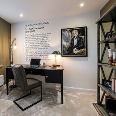 home office with white wall painting frame work desk grey desk