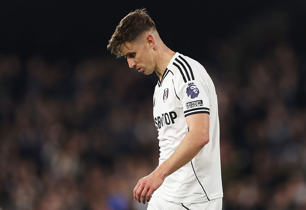 Tom Cairney of Fulham looks dejected as he leaves the field after picking up an injury during the Premier League match between Fulham and Arsenal at Craven Cottage on October 18, 2025 in London, England.