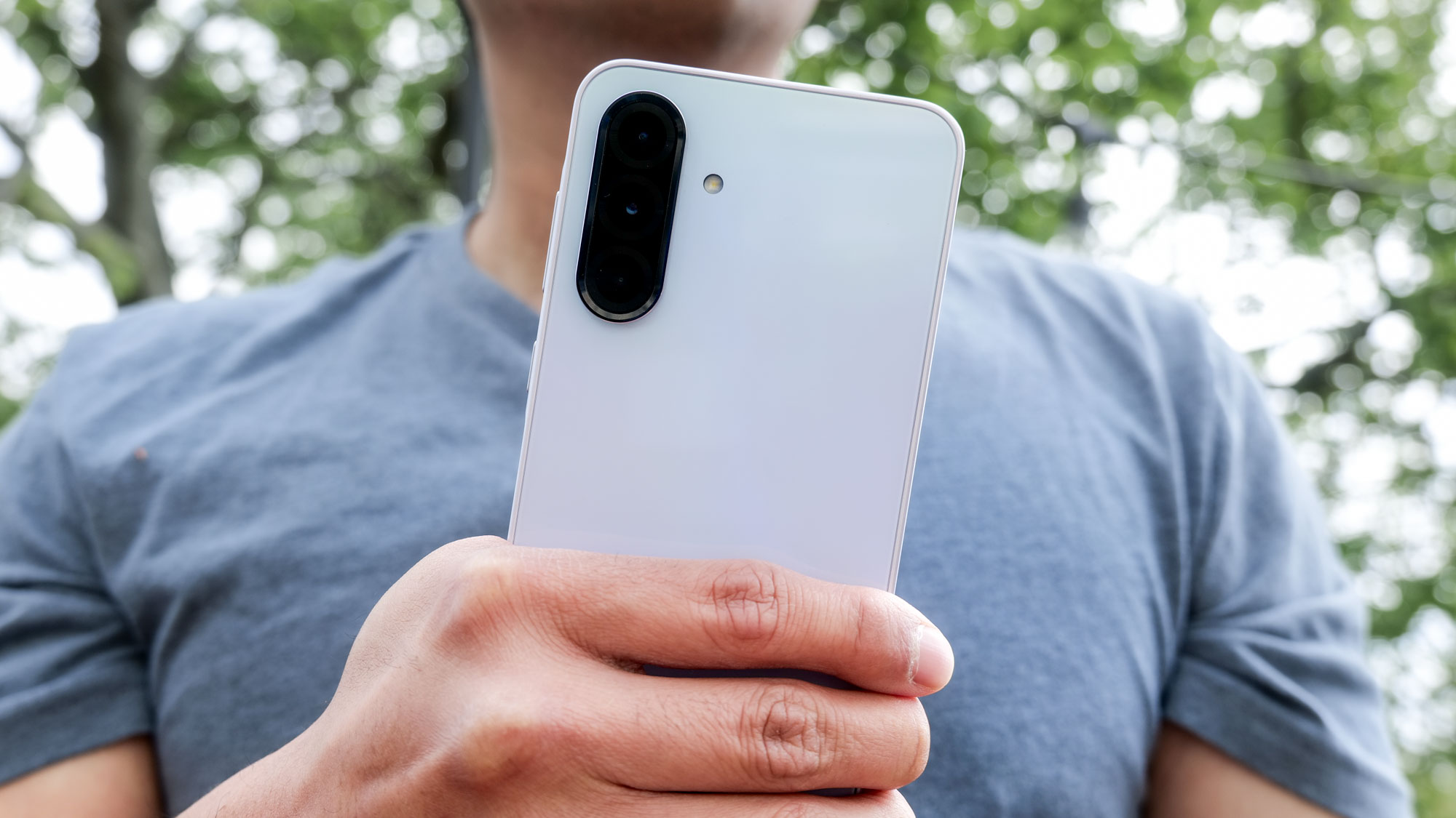 Samsung Galaxy A36 held in the hand.