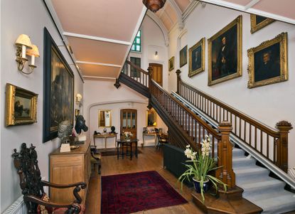 Life at Woodlands revolves around the vast, galleried hall, with its wide oak staircase and magnificent vaulted, plaster-panelled ceiling.
