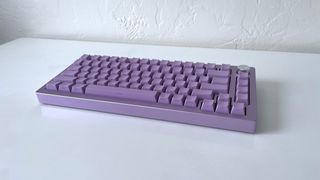 The Epomaker Tide 75 in lavender purple on a white table