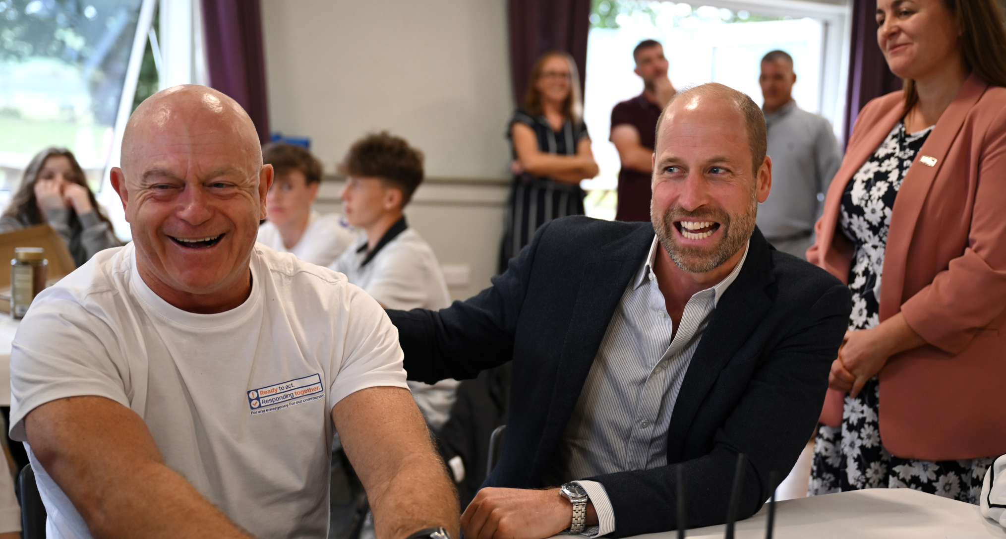 Prince William sitting at a table with Ross Kemp
