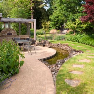garden area with pond and pathway