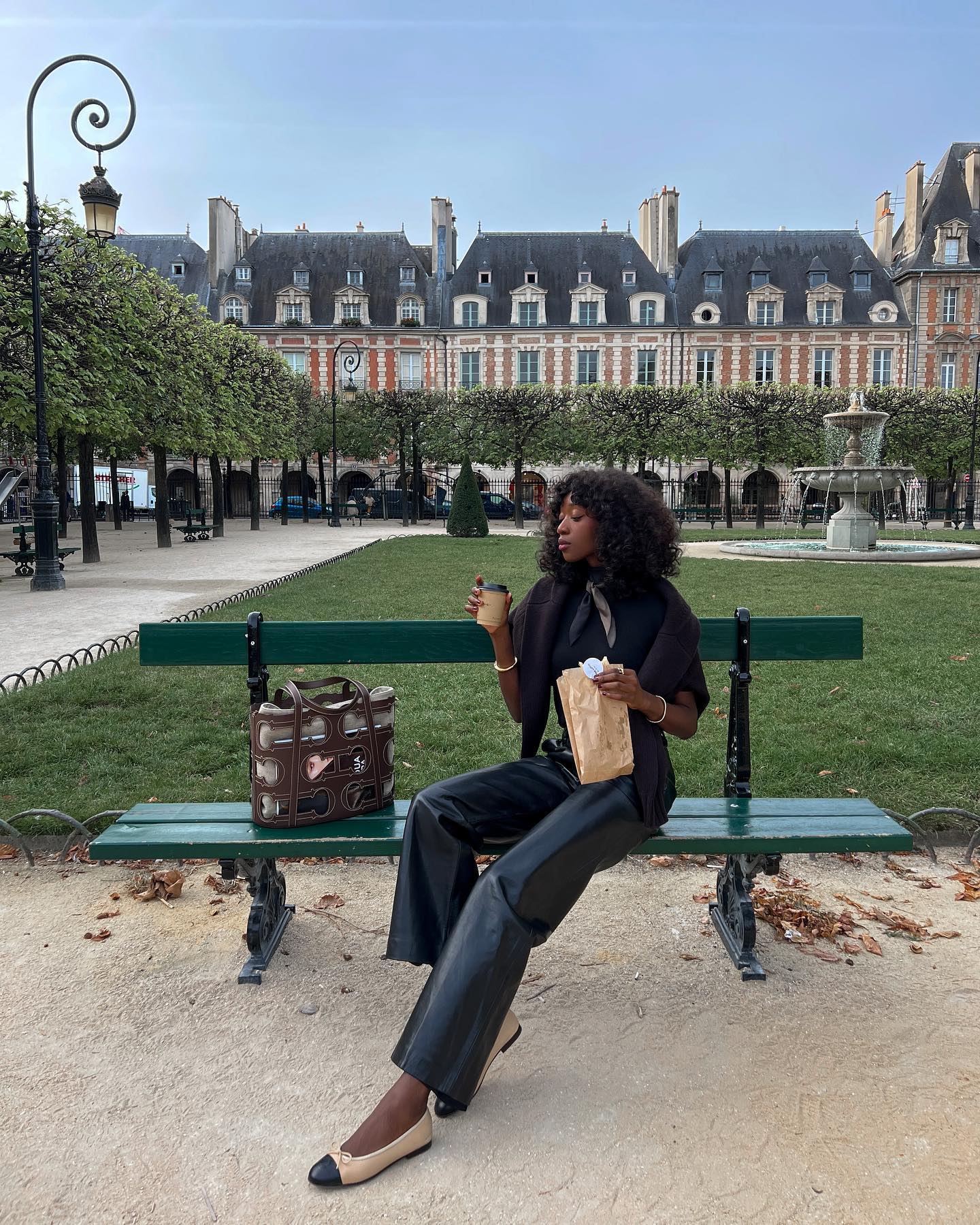 Emmanuelle Koffi wearing black leather trousers.