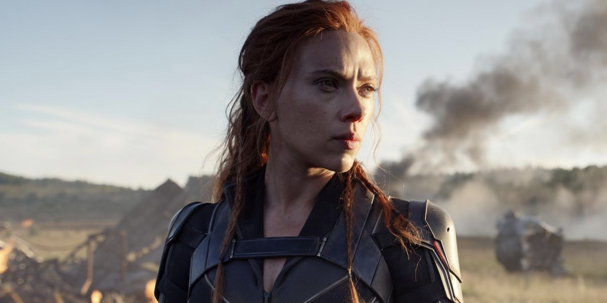 Natasha Romanoff stands in front of smoking debris in &#039;Black Widow&#039;