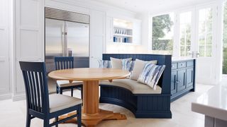 blue and white kitchen with banquette island