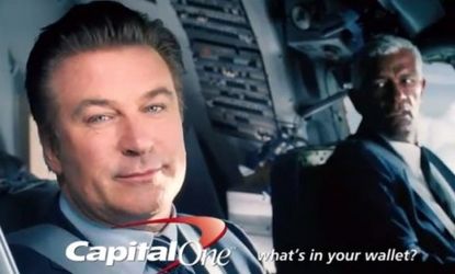 Alec Baldwin stars in a Capital One commercial: The credit card company is the first charged by the Consumer Financial Protection Bureau on charges of misleading customers into purchasing pro
