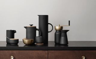 Black coffee set with wooden handles and golden decoration