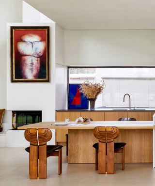 wooden kitchen with art deco bar stalls and bold artwork