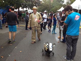 A robot dog makes the rounds at World Maker Faire New York on Sept. 21, 2013.
