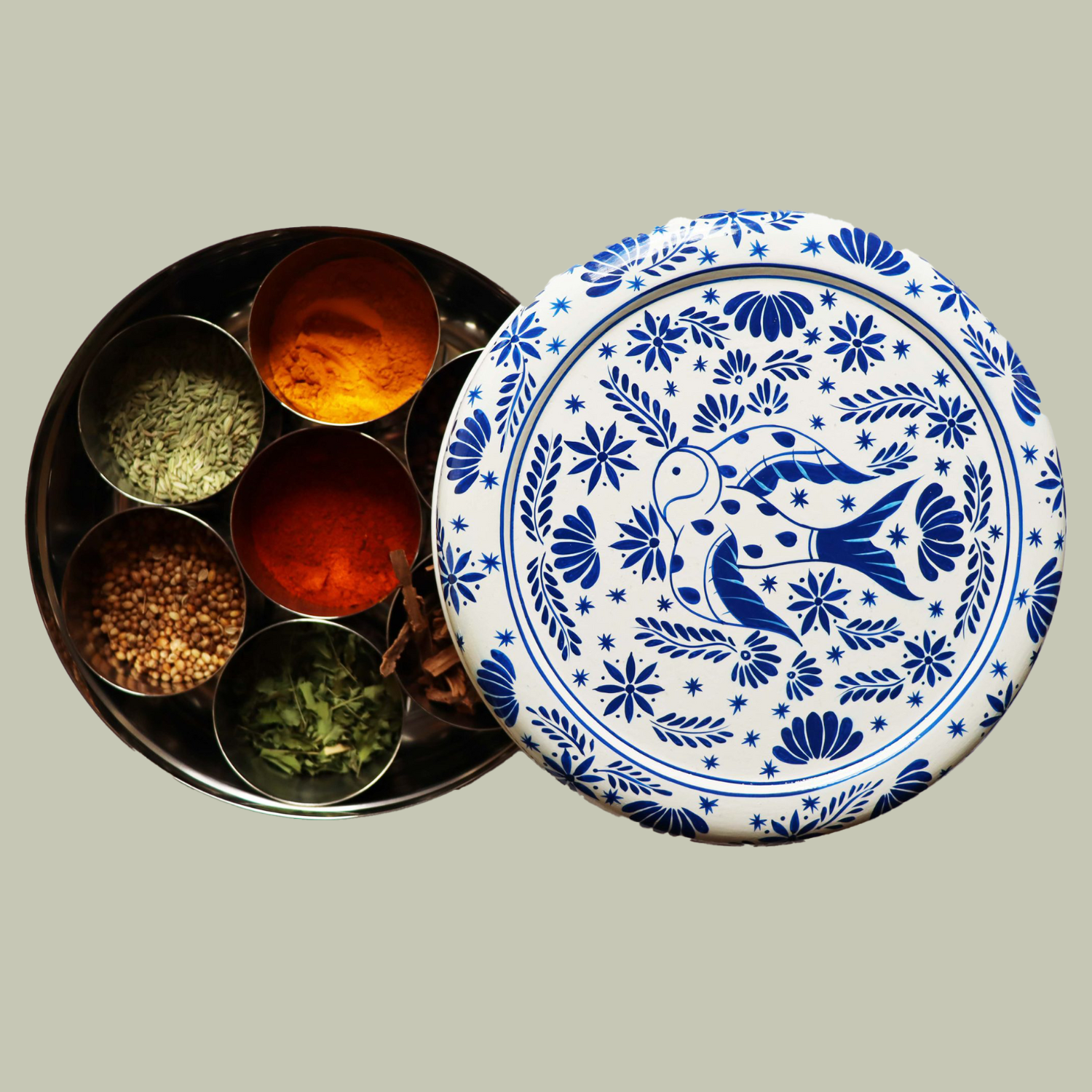 A masala dabba with a blue and white bird design