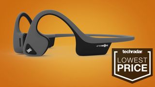 AfterShokz Trekz Air bone conduction headphones next to a sign saying 'Lowest Price'