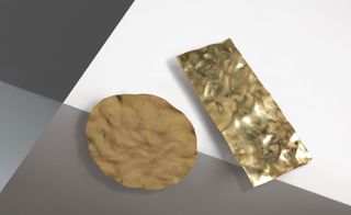 Crumpled pieces of foil are crafted from gold plated brass earrings