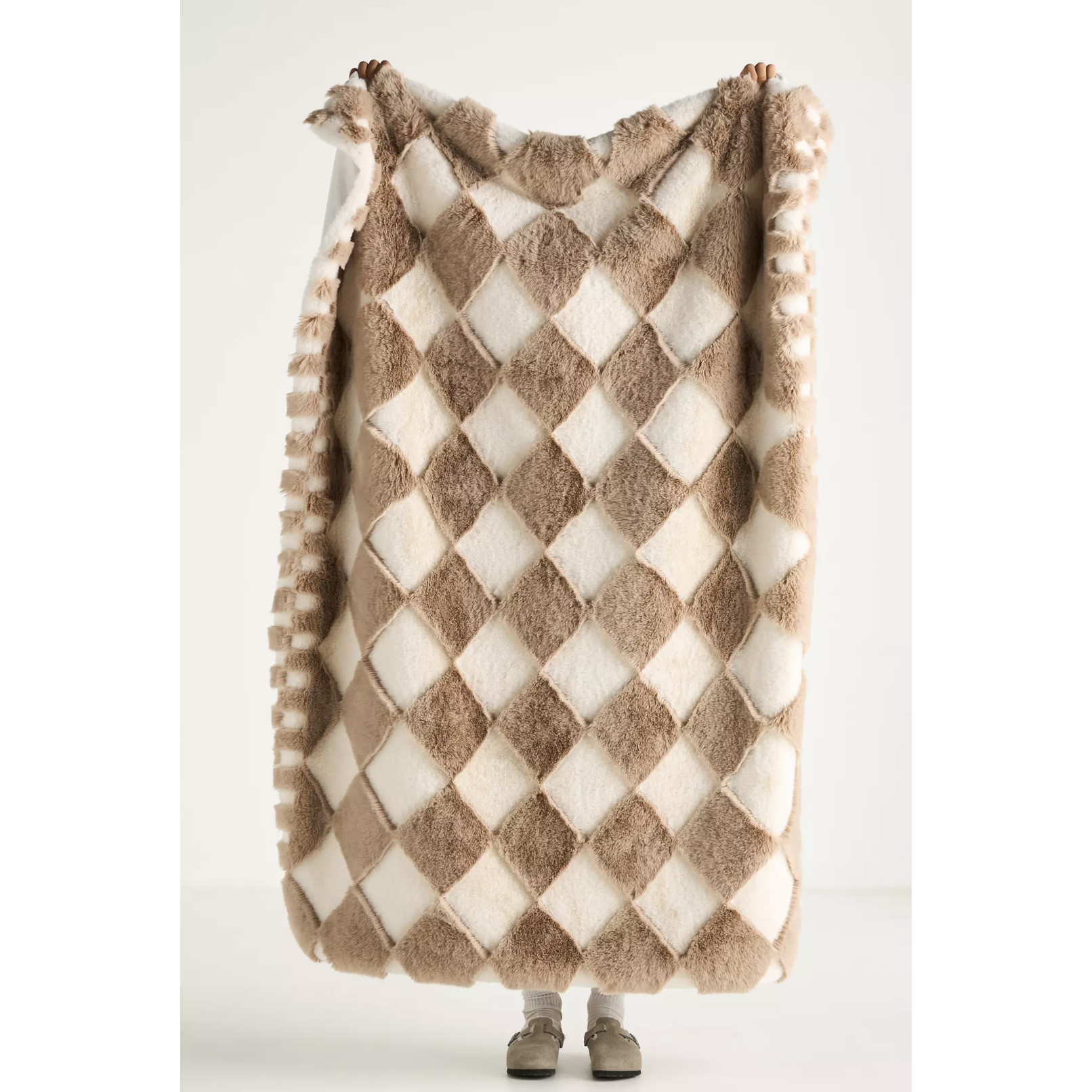 white and brown throw