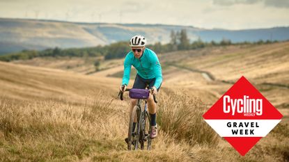 Male cyclist riding on gravel