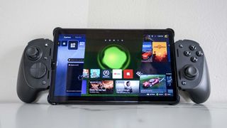 A tablet with the Razer Kishi Ultra mobile game controller attached with home screen shots of the PS5, Xbox and Steam on screen