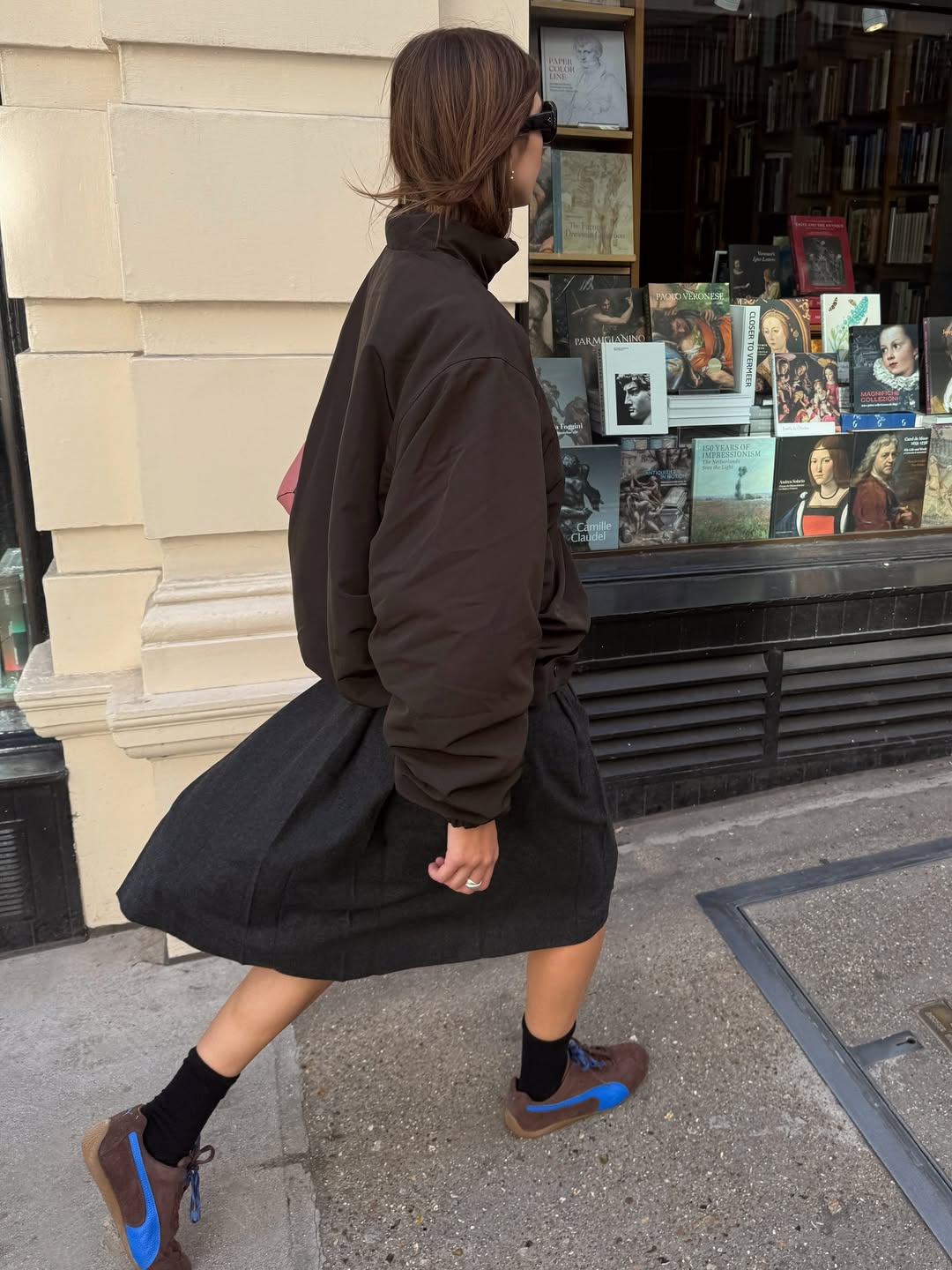 Influencer Poppy Almond wearing dark brown trainers.