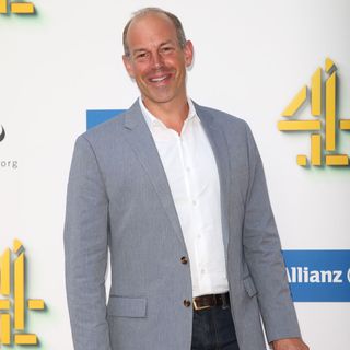 phil spencer with blue coat and white shirt