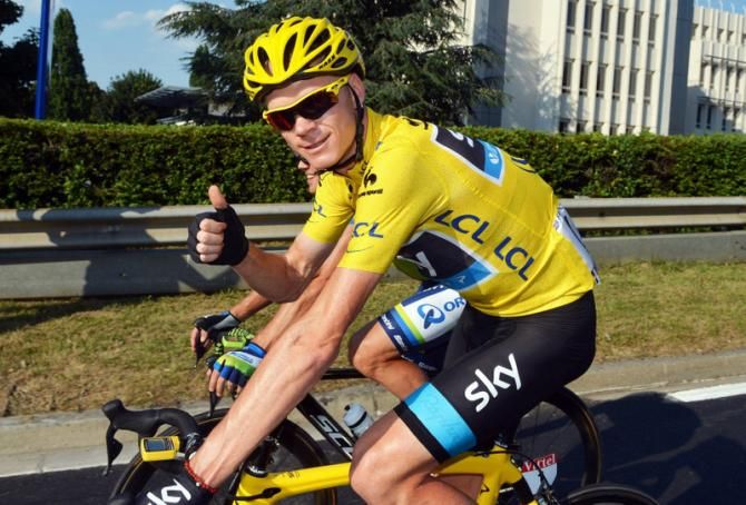 Thumbs up. Chris Froome (Sky) en route to Paris