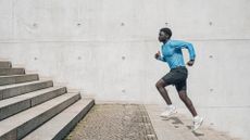 A man running up the stairs outside